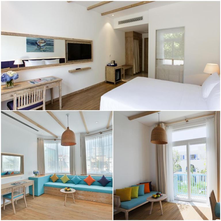 Phòng Elite Deluxe trang bị nhiều tiện nghi hiện đại, trong đó có sofa cao cấp đặt ngay bên cửa sổ thoáng rộng. 